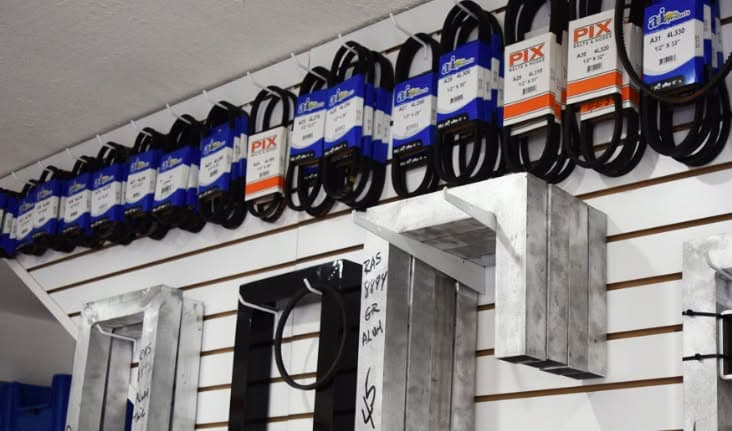 Drive belts and gate hardware hanging on the wall at RAS Kendall
